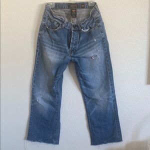 Relaxed Blue Jeans with Cropped Length and Distressed Details